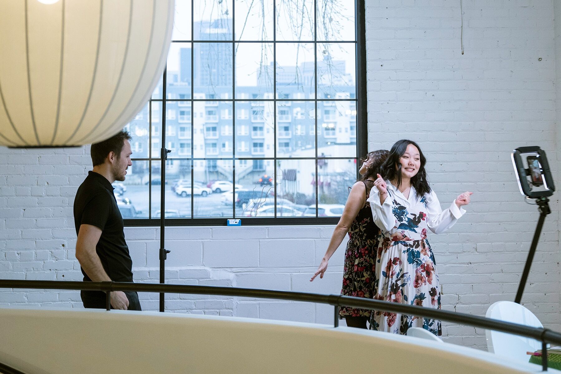 Guests posing on a 360 photo booth platform at a Minneapolis event venue