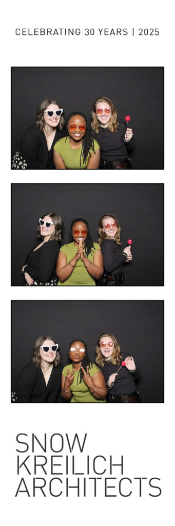 Three women next to black backdrop