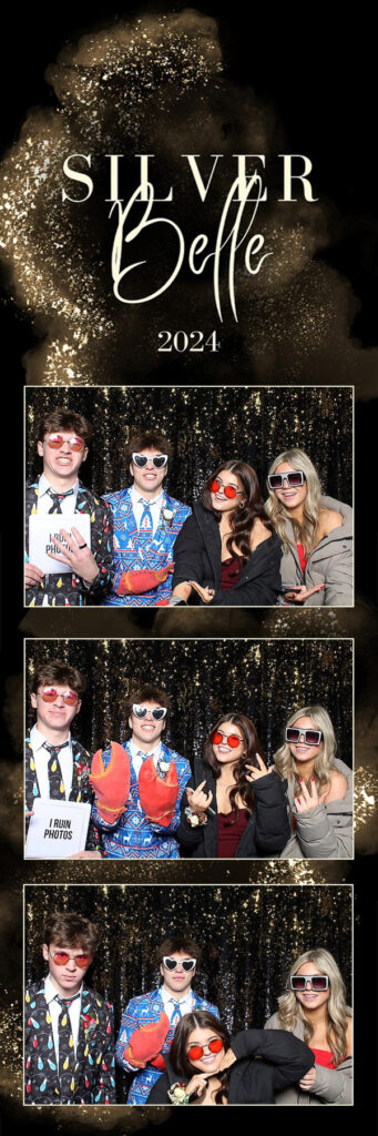 4 people with glasses and signs