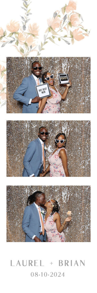 A couple posing with signs and glasses